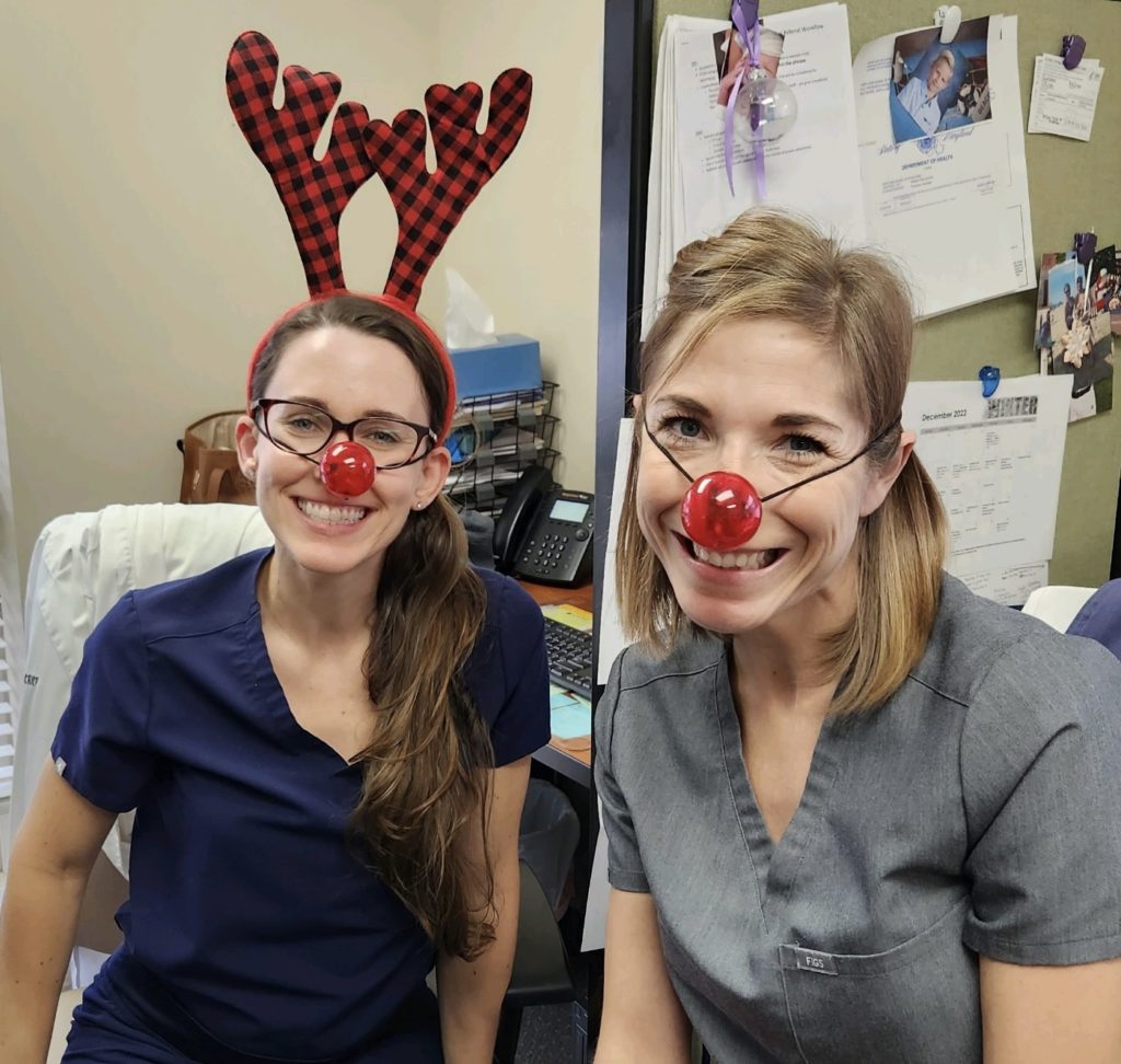 Picture of team members with Rudolph costumes.